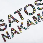 White Satoshi Nakamoto Studded Logo Tee Close-Up View